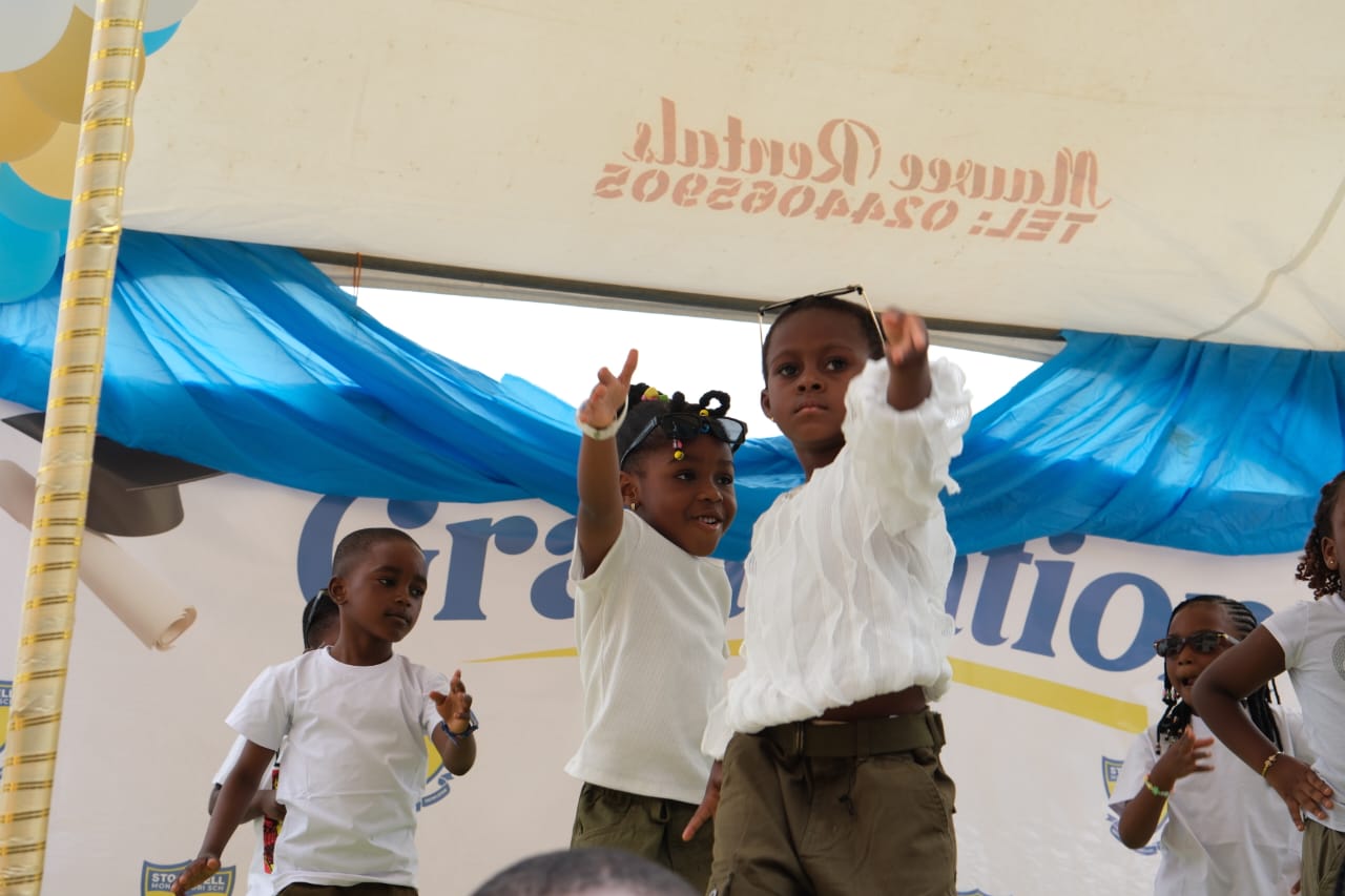 Children dancing at graduation